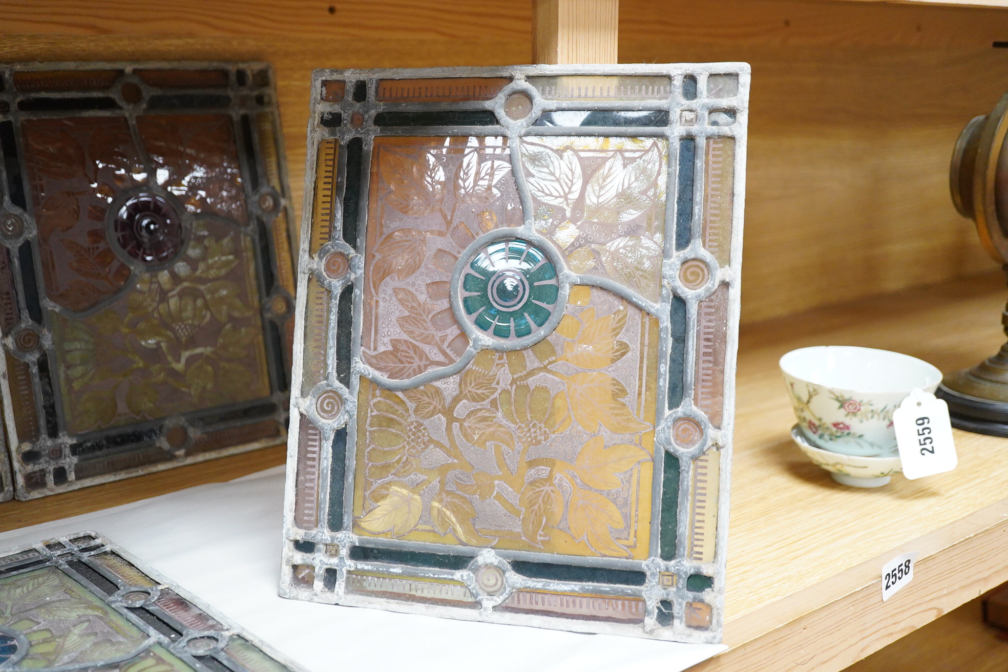 A set of eight late 19th century leaded stained glass panels, 23cm x 28cm